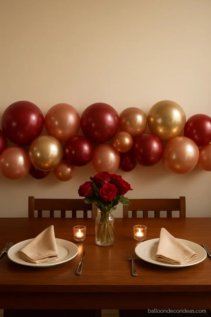 Balloon decoration for anniversary dinner with a low table garland in red and gold