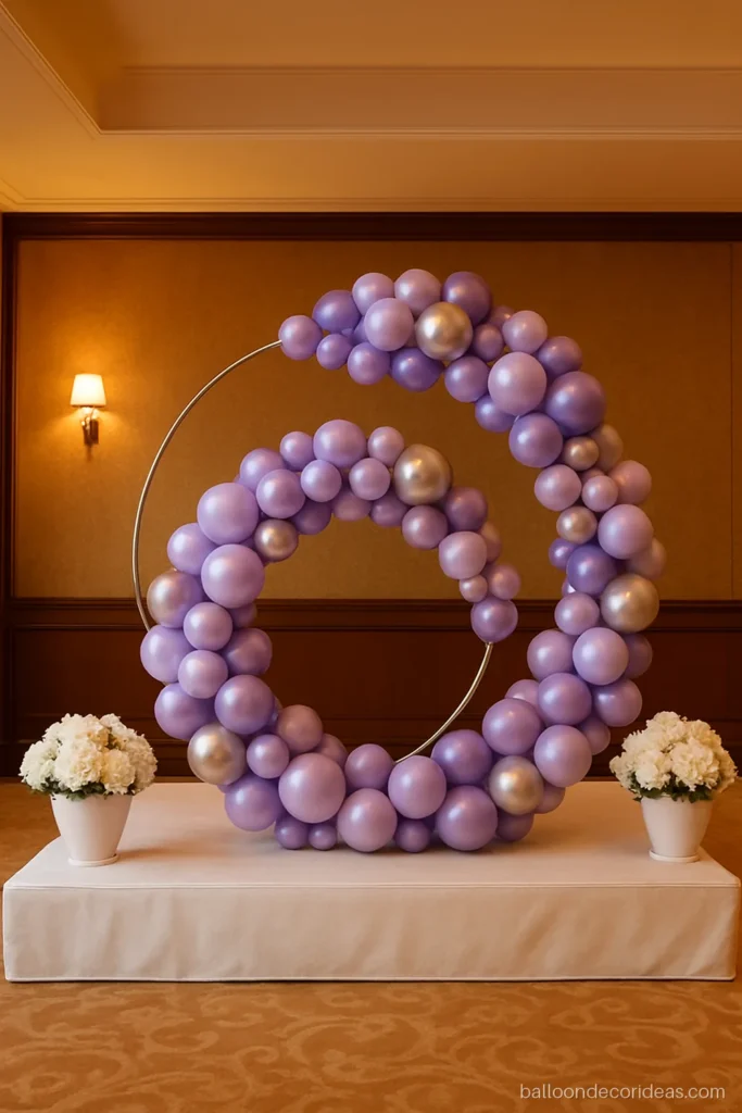 Ring balloon decoration ideas with a double ring in lavender and silver on a small stage
