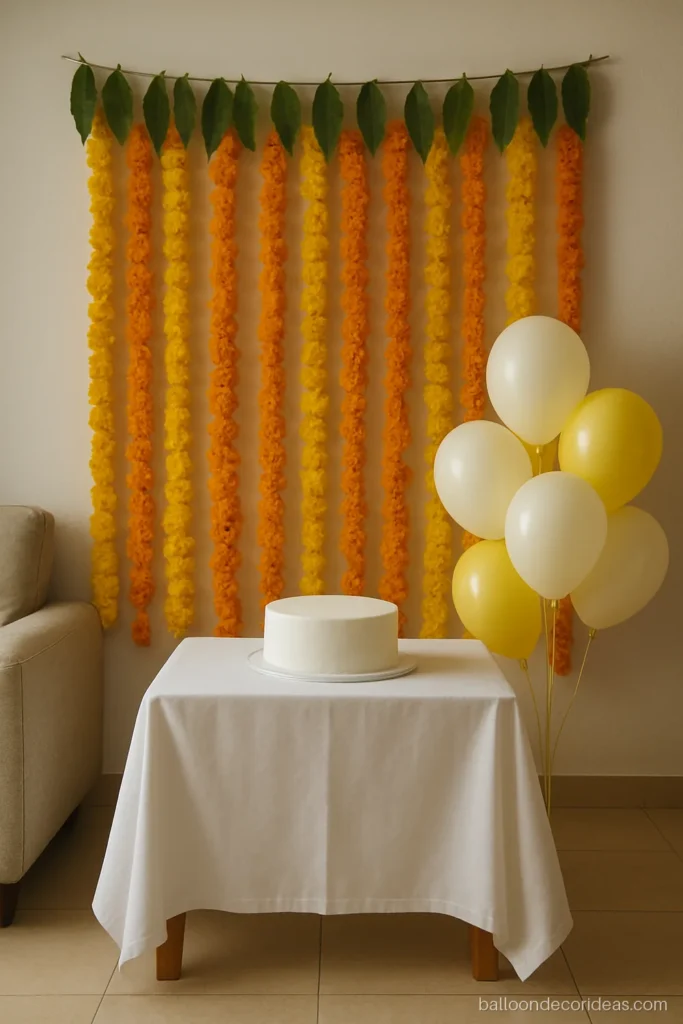 Simple balloon decoration ideas at home with marigold garlands and a few white balloons