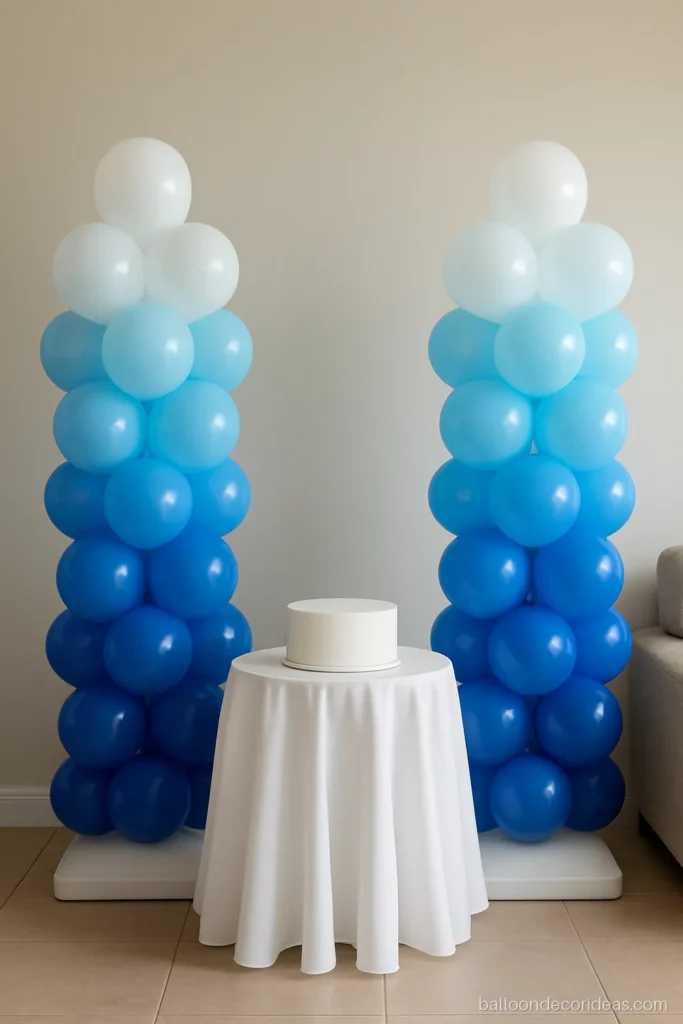 White blue balloon decoration columns in an ombre fade from white to royal blue