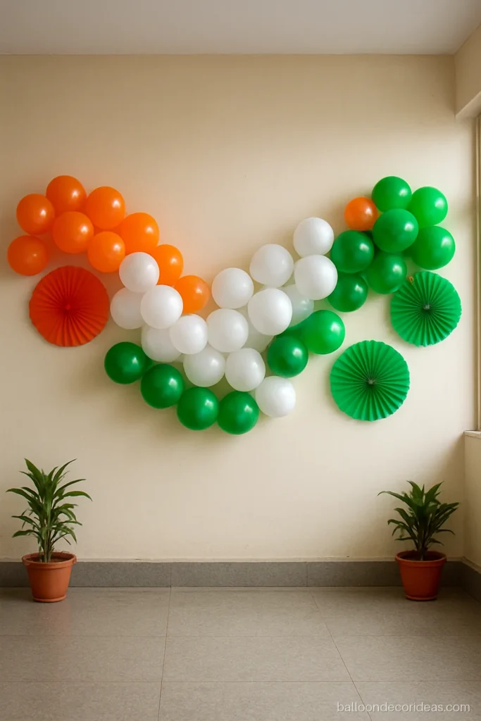 New tiranga balloon decoration with a wave garland and paper fans on a wall