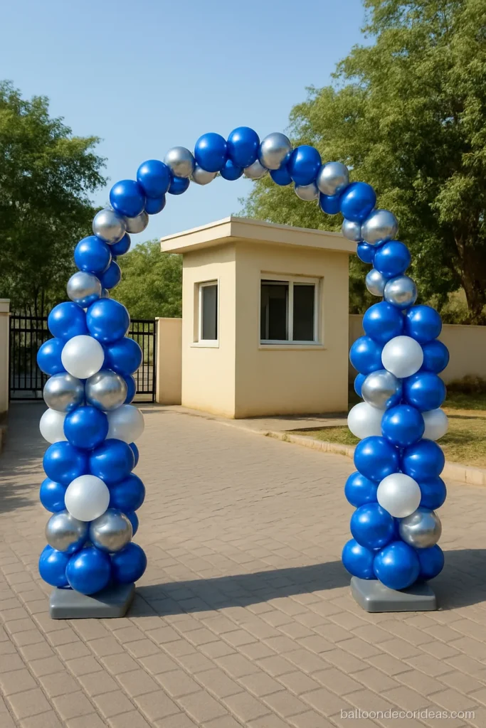 Entrance balloon arch decoration at a society entry with blue and silver twin columns