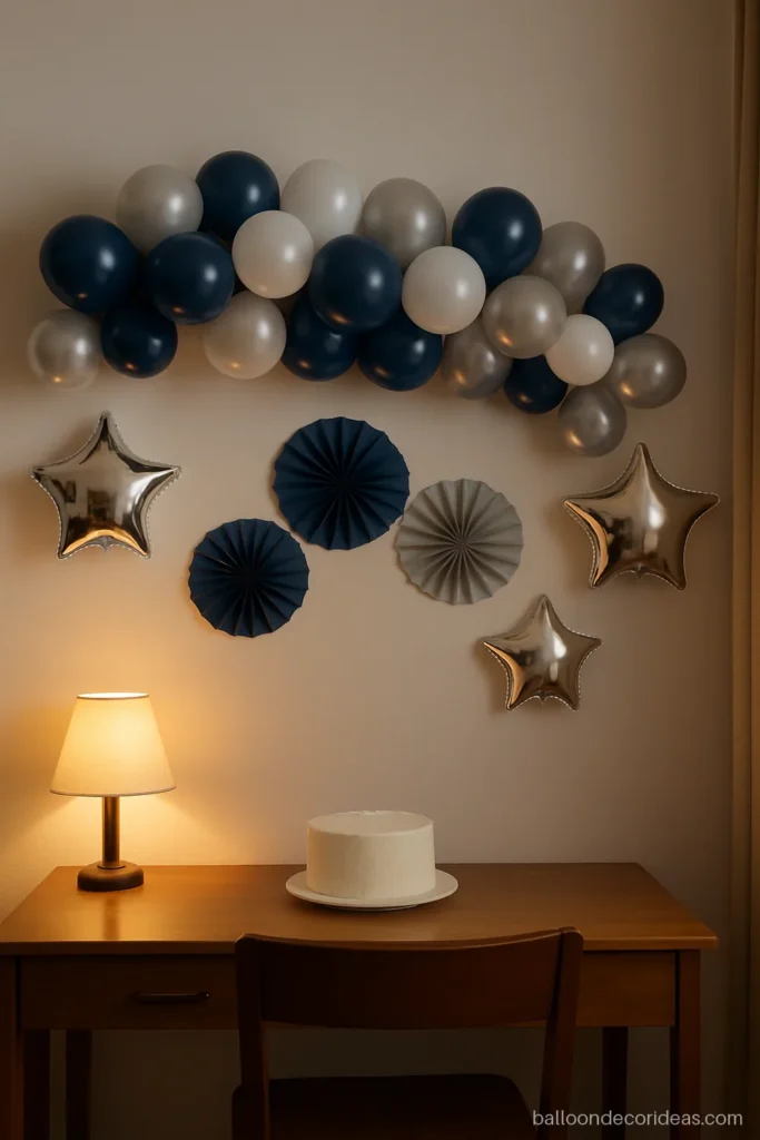 Birthday balloon decoration kit set up on a bedroom wall with paper fans