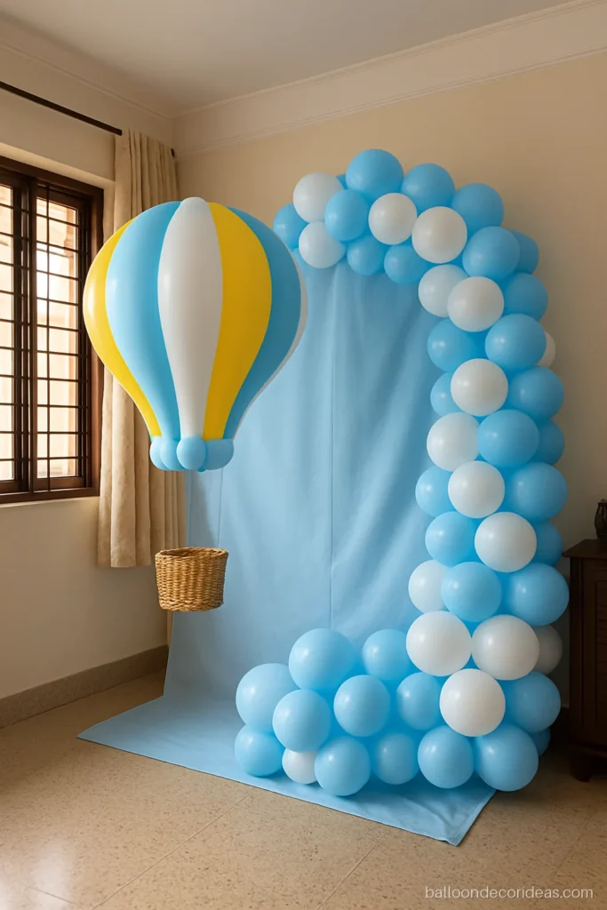 Hot air balloon decoration shape made of balloons beside a half arch
