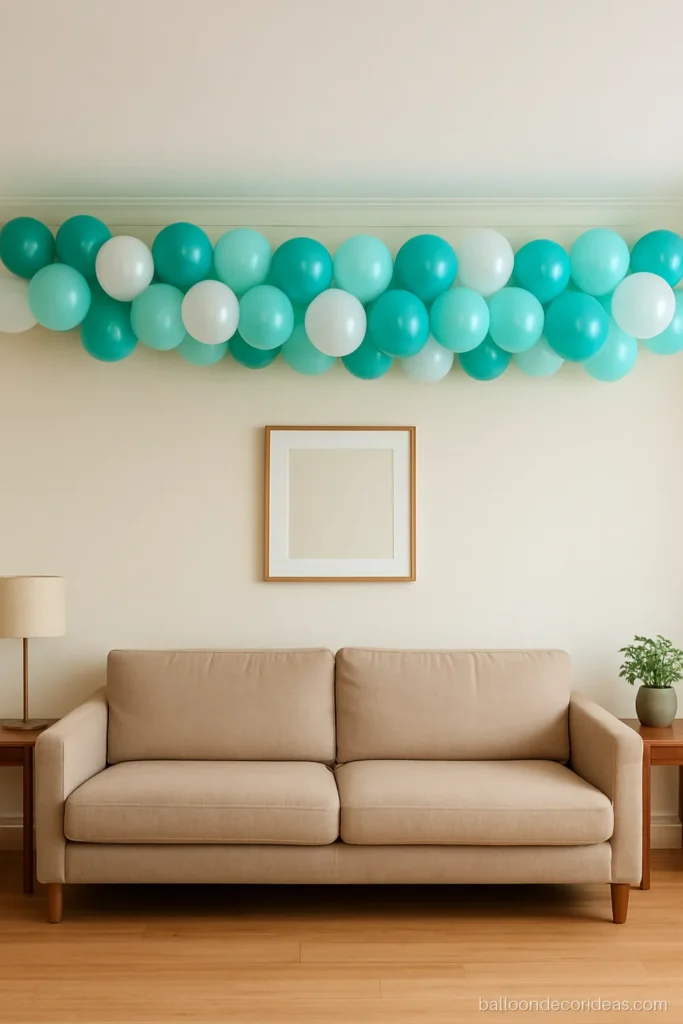 Upper wall balloon decoration border in teal and white running along a living room