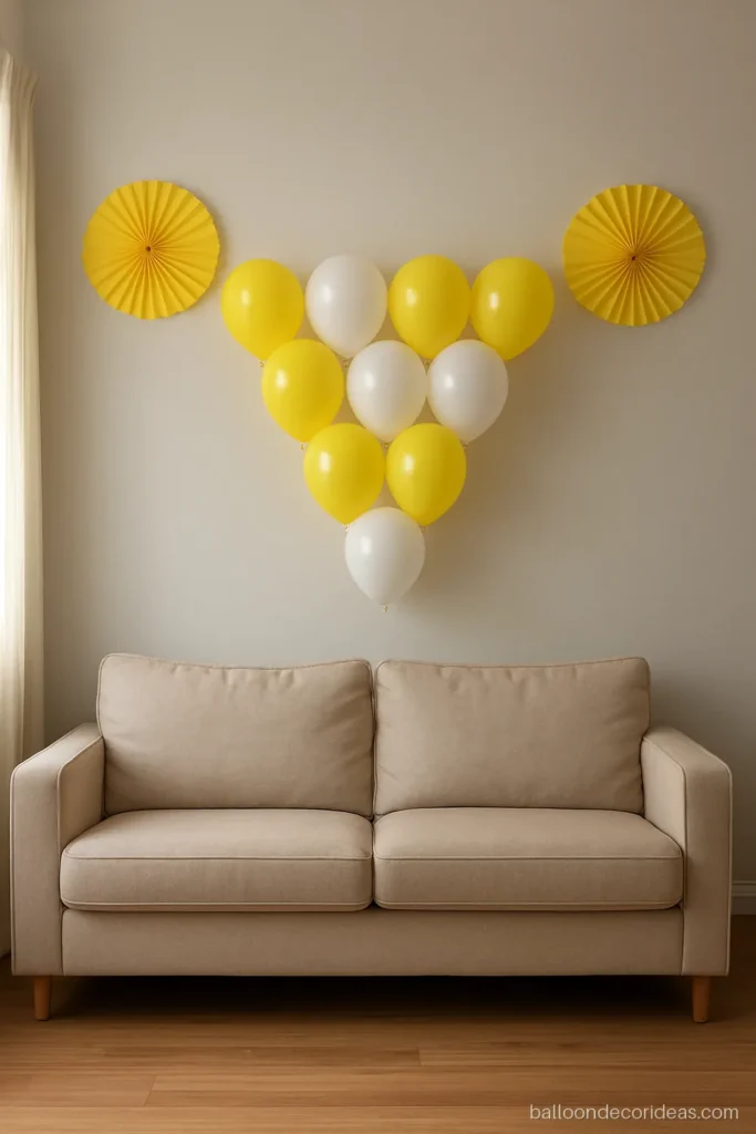 Normal balloon decoration with a yellow and white triangle cluster above a sofa