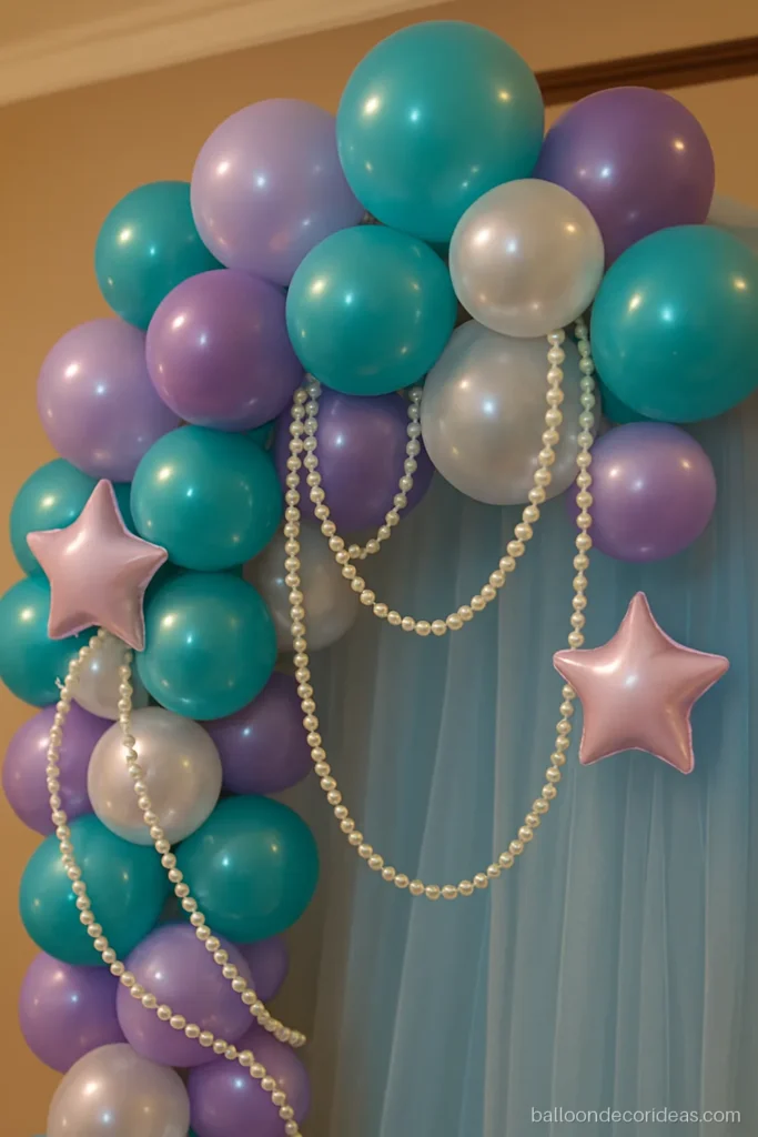 Close-up of a mermaid balloon decoration arch with scale pattern and pearls